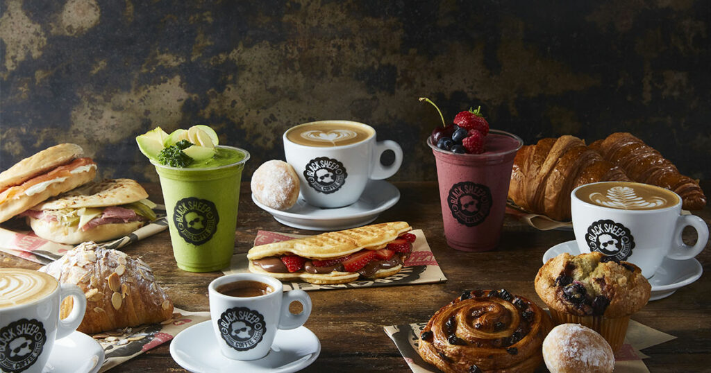 a selection of coffees, iced drinks and pastry to show black sheep coffee at Liverpool ONE