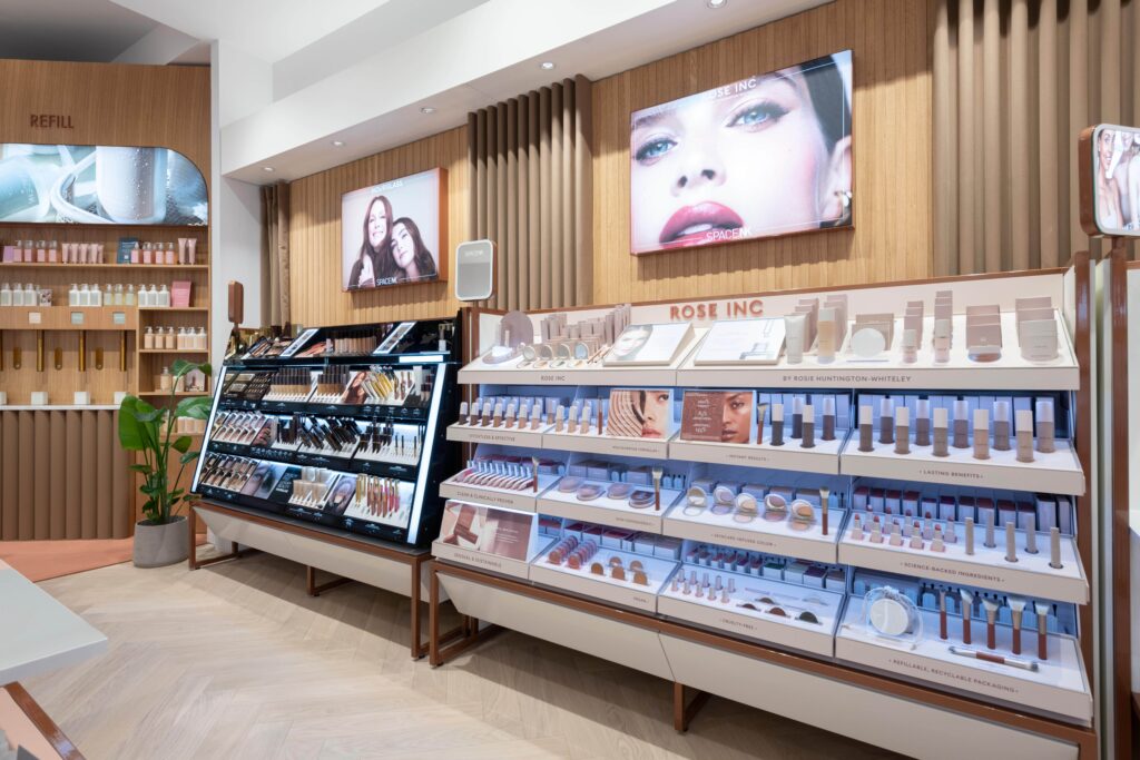 A store interior showing beauty stands, announcing Space NK