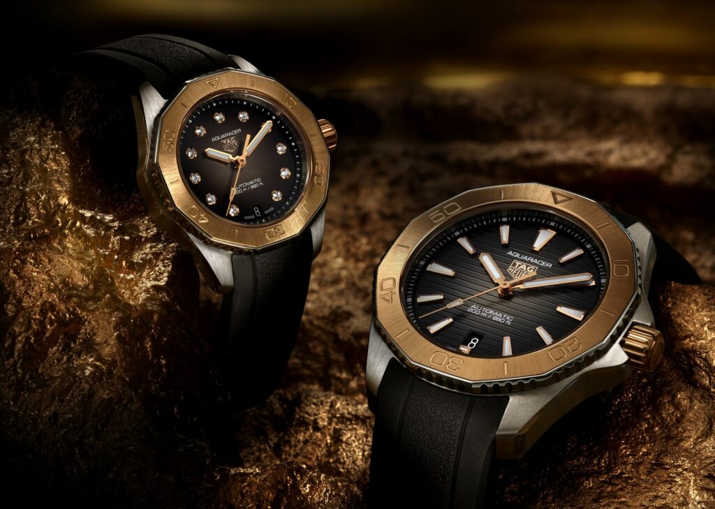 two luxury watches against a dark background